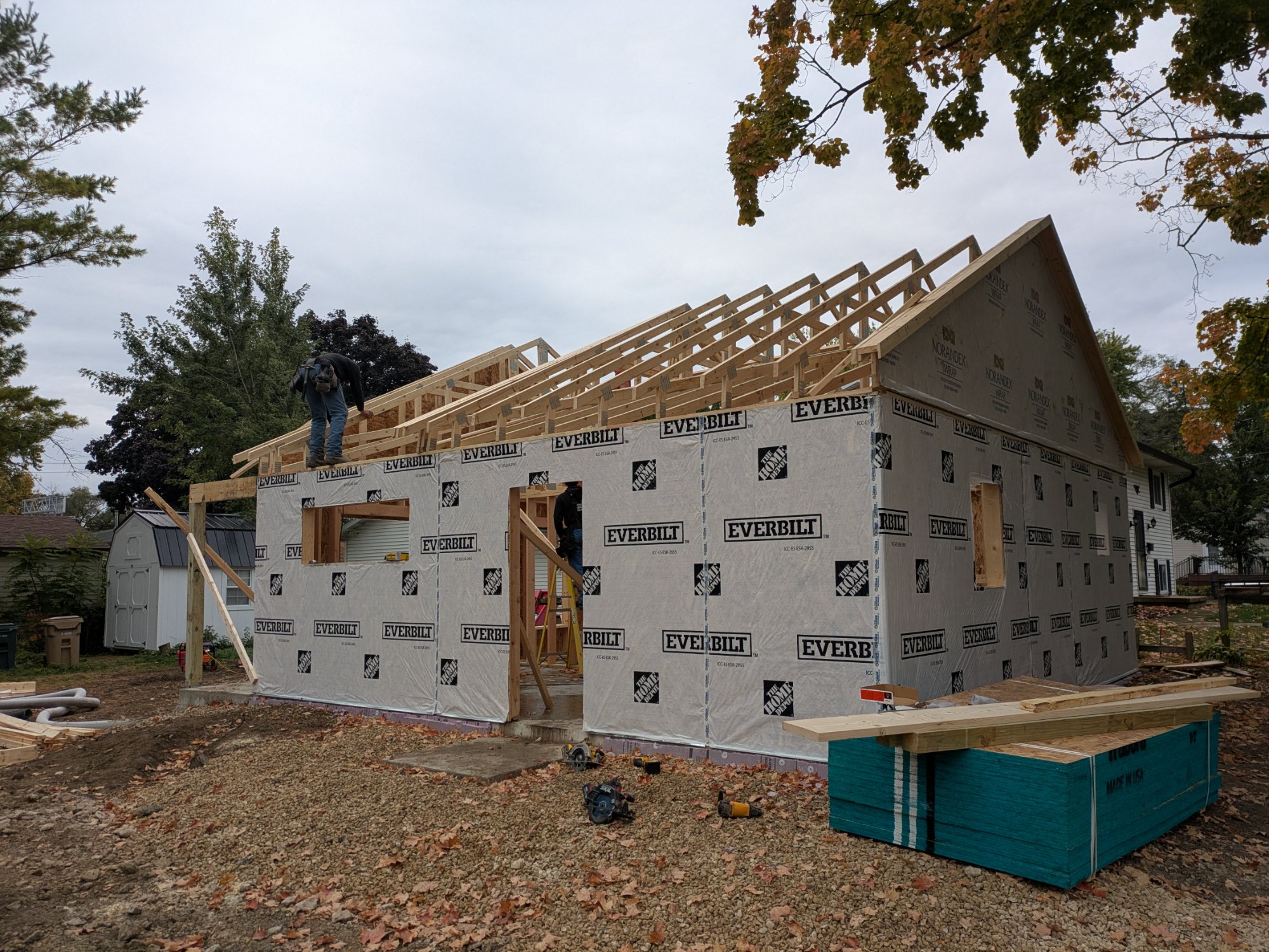 Exterior framing with housewrap and crew setting trusses — North Side ADU Madison WI, October 2025